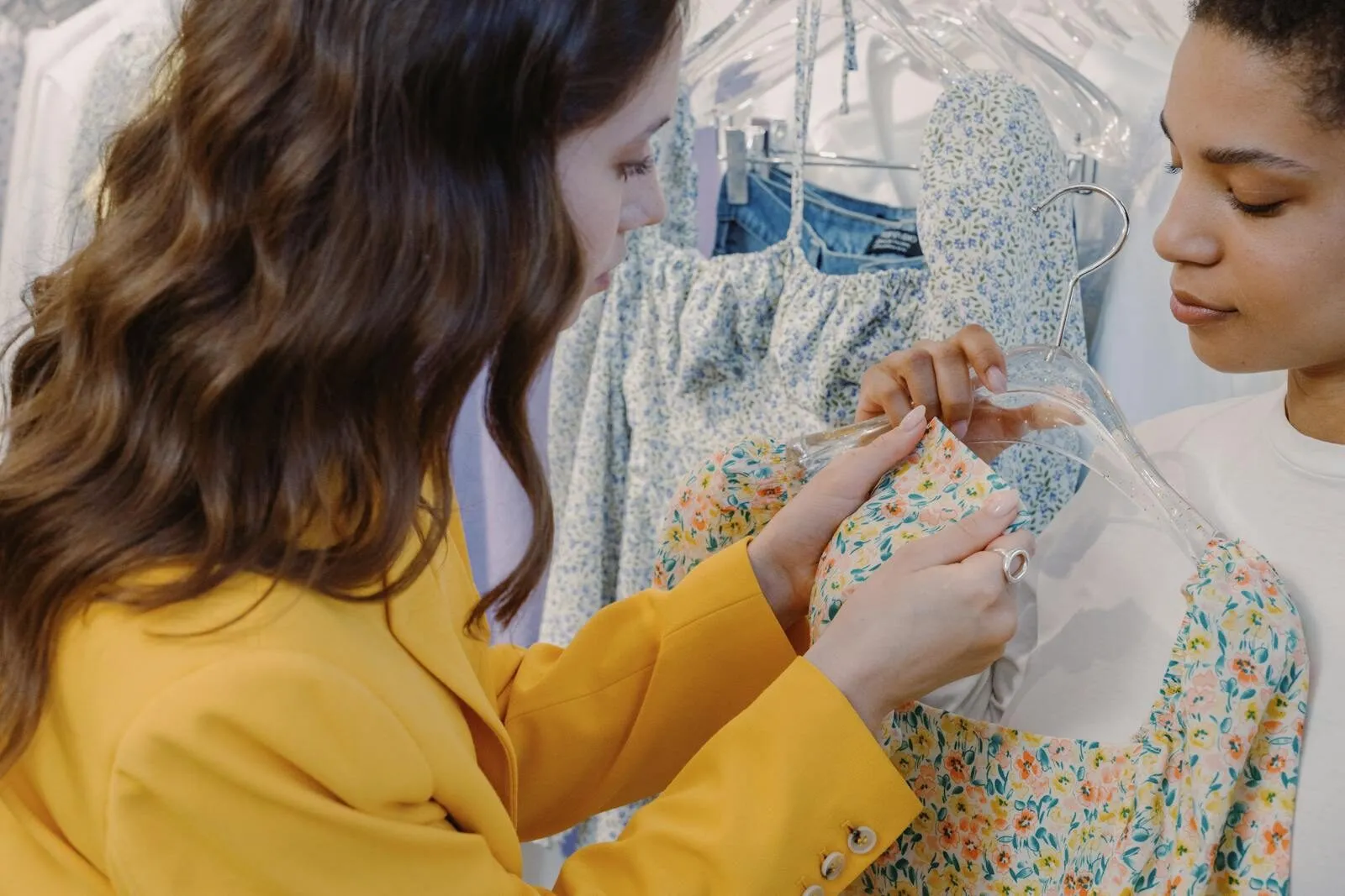 Two women shopping for dresses in a boutique, anti-greenwashing regulation requires verifiable sustainability claims