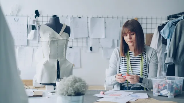 Small fashion brand designer preparing a Digital Product Passport in her studio