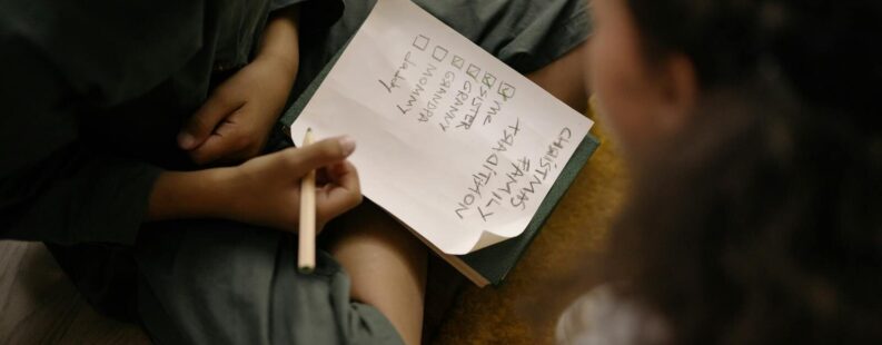 Fashion brand owner reviewing how to choose a DPP platform on a laptop