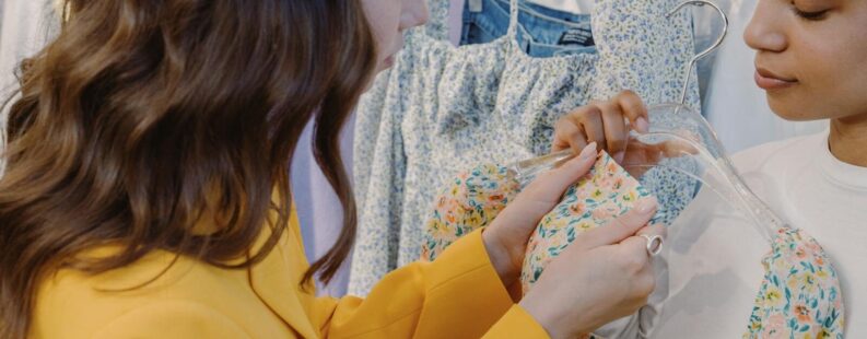 Two women shopping for dresses in a boutique — anti-greenwashing regulation requires verifiable sustainability claims