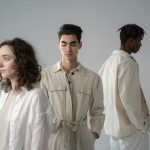 Digital product passport consumer — young adults in stylish neutral outfits during a studio photoshoot