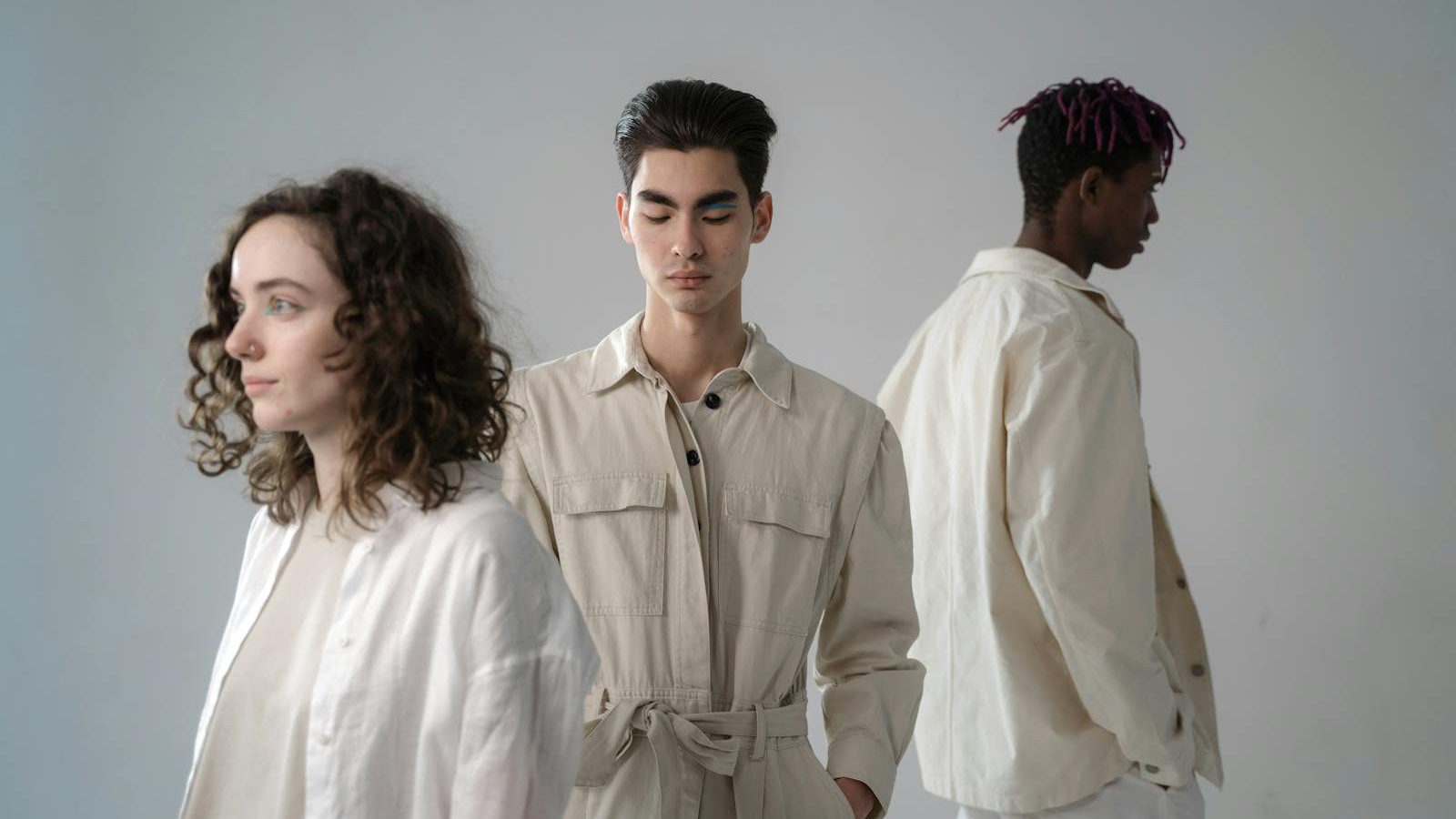Digital product passport consumer — young adults in stylish neutral outfits during a studio photoshoot