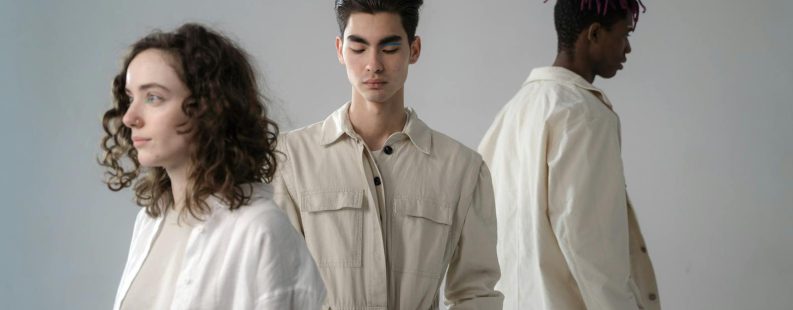 Digital product passport consumer — young adults in stylish neutral outfits during a studio photoshoot