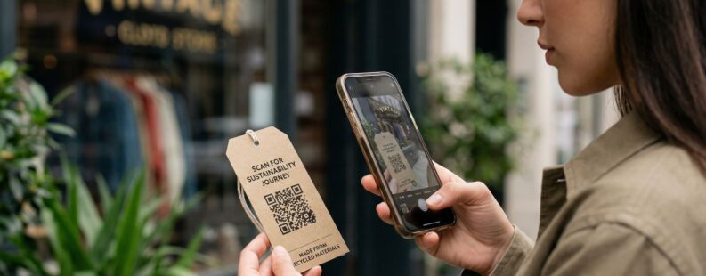 A woman scanning a QR code on a garment tag