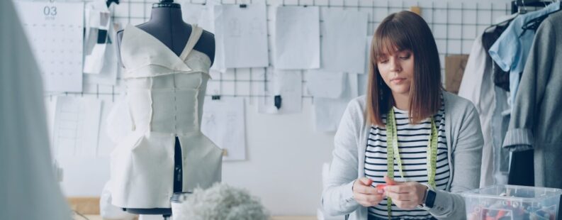 Small fashion brand designer preparing a Digital Product Passport in her studio