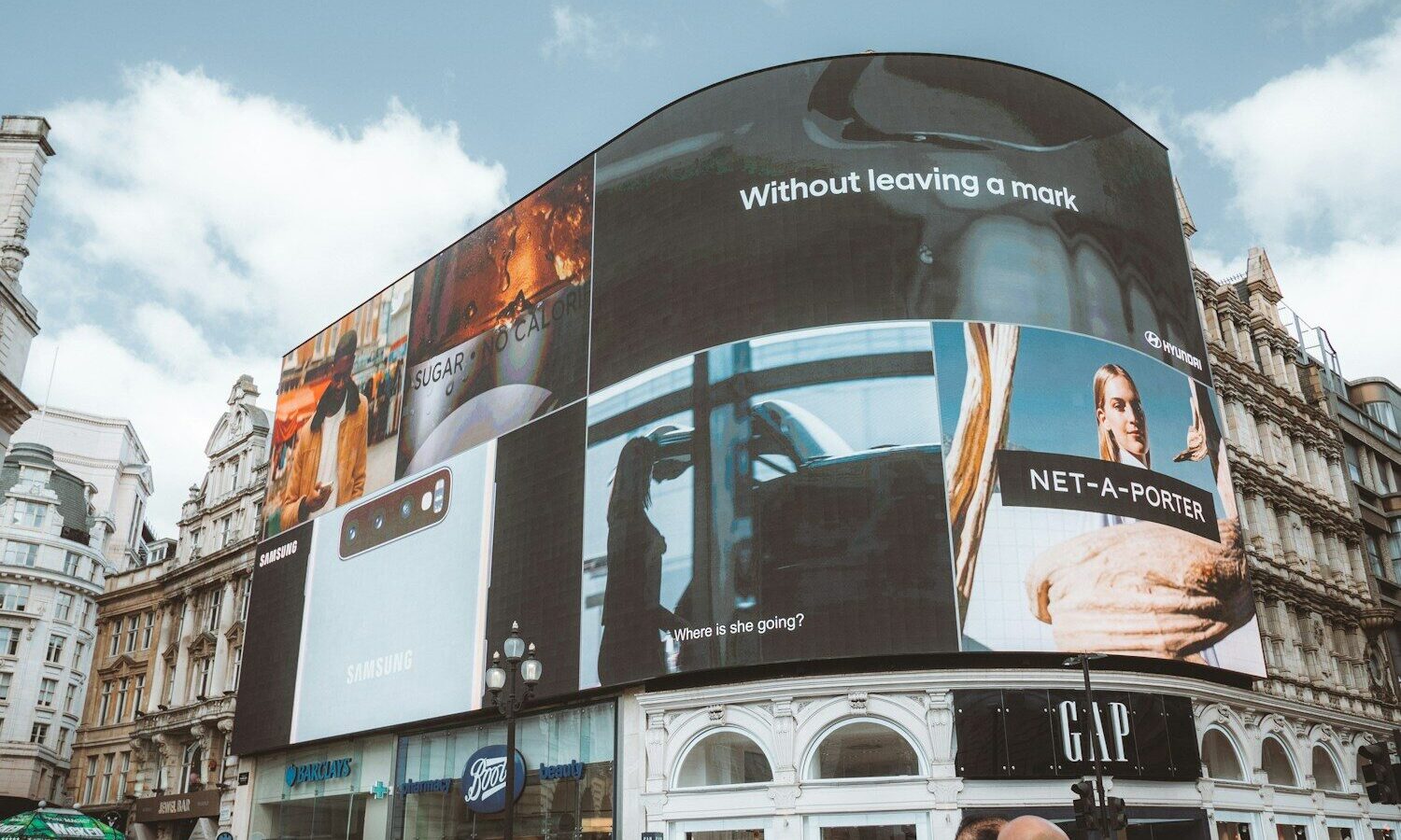 Digital billboards representing how a DPP can be used as a marketing tool for fashion brands